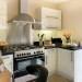 Fabulous convivial kitchen -friends, glass of wine & cook ...